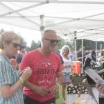 Photos by Danielle Chastaine                                 Residents tried cheese, cider and sausages from local vendors on Saturday, Aug. 17.