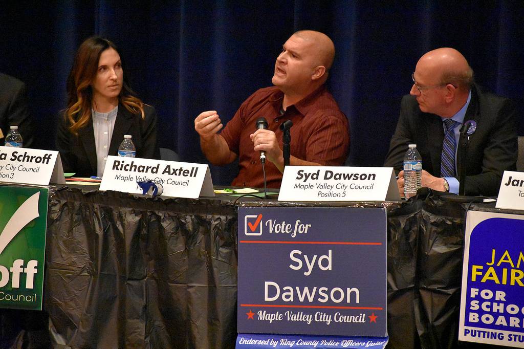 Photo by Haley Ausbun. Position 3 candidate Victoria Schroff and position 5 candidates Richard Axtell and Syd Dawson.