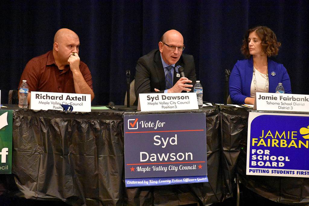 Photo by Haley Ausbun. Position 5 candidates Richard Axtell and Syd Dawson, and school district 3 candidate Jamie Fairbanks.