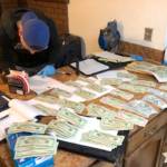 Stolen guns, illegal drugs and cash found in Covington home