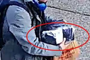 Security camera footage shows a suspect in three different crimes walking away with stolen mail on Friday, Dec. 6, 2019. Photo courtesy of The City of Covington.