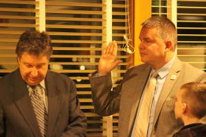Maple Valley Mayor Sean P. Kelly takes the Oath of Office with his son in attendance during the first council meeting of the year on Monday, Jan. 6, 2019. Photo by Danielle Chastaine.