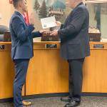 Newley elected Covington City Councilmember, and youngest serving councilmember, Jared Koukal is sworn-in by Mayor Jeff Wagner during the Tuesday, Jan. 14, regular council meeting. Photo by Karla Slate.