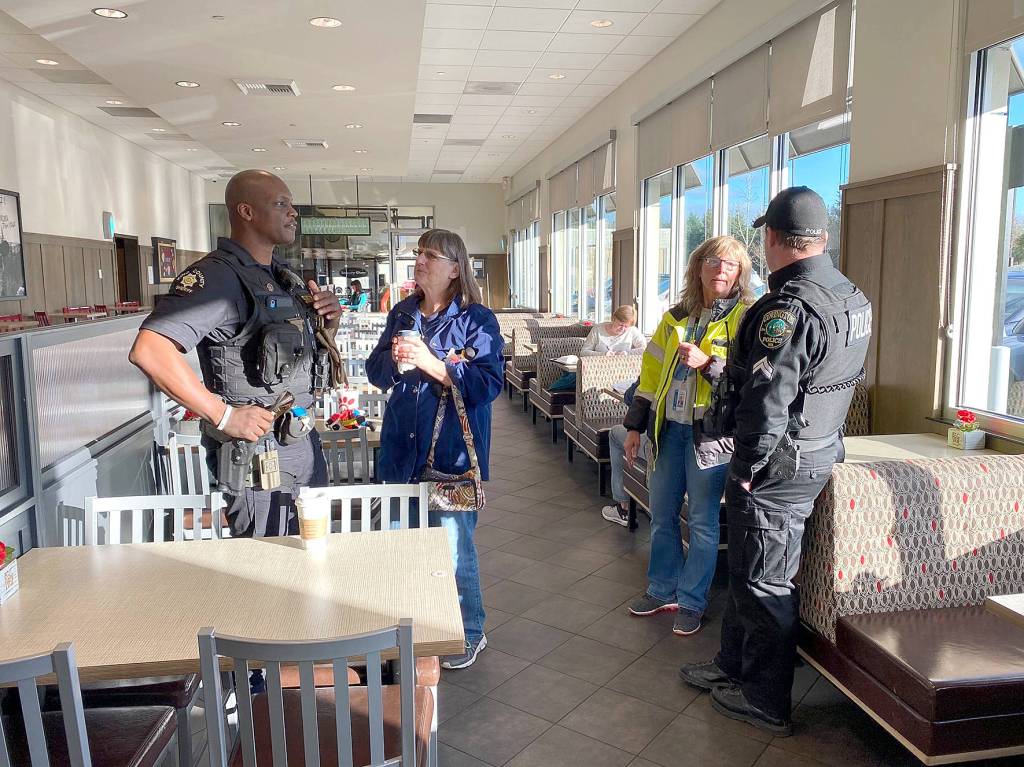Covington Police officers speak with residents and answer their questions during the regular Coffee with a Cop event on Monday, Feb. 10, 2020. Photo courtesy of the City of Covington.