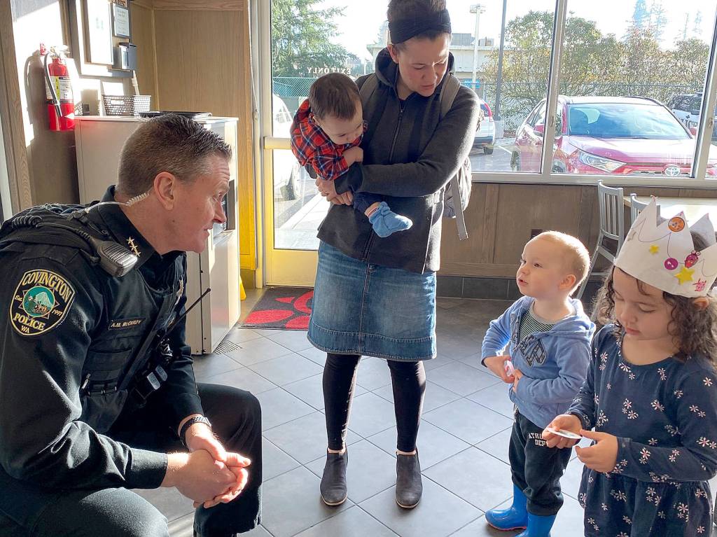 Local kids hang out near mom as they meet Covington Police Chief Andrew McCurdy at the Coffee with a Cop event on Monday, Feb. 10, 2020. Photo courtesy of the City of Covington.