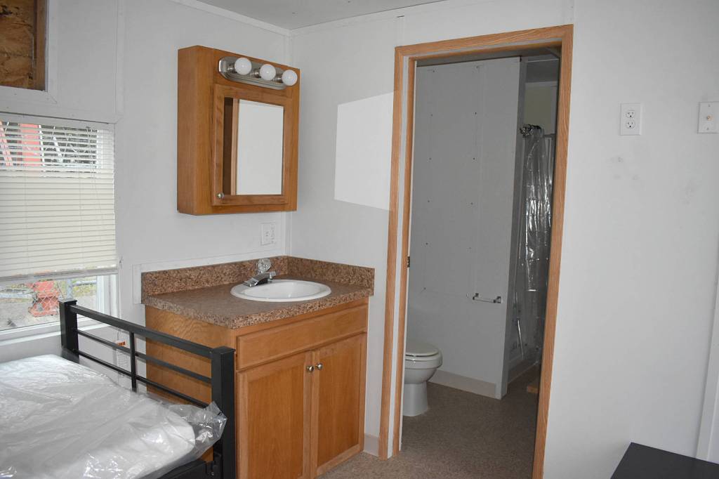 Photo by Haley Ausbun. A preview of the first modular unit being used to house King County residents under quarantine for COVID-19, coronavirus. The units will be located on a county-onward parcel in White Center, where an old office building is planned to be demolished to make space.