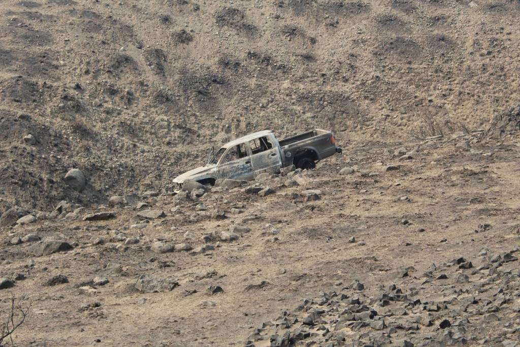 The truck of the Renton family as it was found Tuesday. While fleeing the Cold Springs Fire two adults were severely burned and one toddler died. Courtesy photo/Okanogan Sheriffs Office                                The truck of the Renton family as it was found Tuesday. While fleeing the Cold Springs Fire two adults were severely burned and one toddler died. Courtesy photo/Okanogan Sheriffs Office