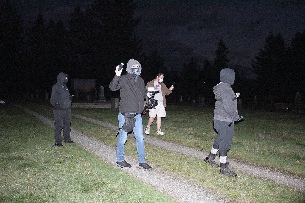 The first part of Cascadia Paranormal Investigations exploration of the Black Diamond Cemetery involved trying to find all the non-paranormal explanations for the phenomenon some people have reported at the site before sitting down with their arsenal of electronics to find any evidence of ghosts or spirits. Photos by Ray Miller-Still