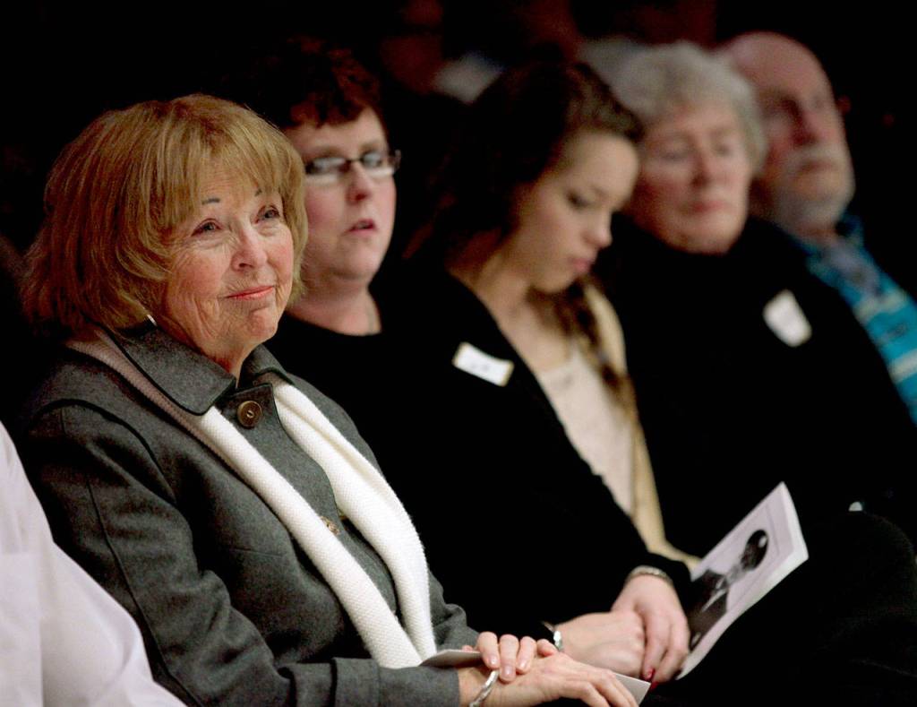 Kathy Parks and family members listen to speakers during the Gary Parks Remembrance ceremony at Everett Community College in 2012. From left: Kathy Parks, daughter Jennifer Parks, granddaughter Marissa Van Ry, Carol and bother John Parks. (Michael OLeary / Herald file)