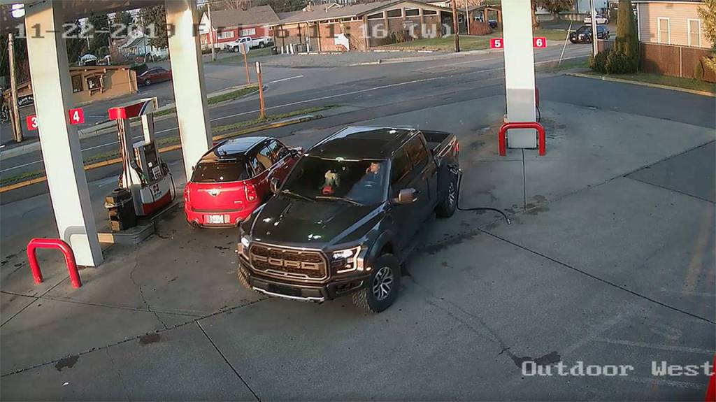 Image courtesy Cenex gas station
This security footage at the Cenex gas station in Black Diamond shows Anthony Chilcott on his phone before entering, and driving off with, Carl Sanders Ford Raptor and Monkey, his poodle, in the front seat.