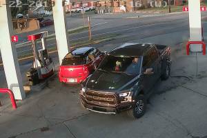 This security footage at the Cenex gas station in Black Diamond shows Anthony Chilcott on his phone before entering, and driving off with, Carl Sanders Ford Raptor and Monkey, his poodle, in the front seat. Image courtesy Cenex gas station