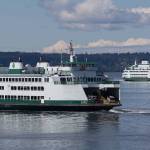 Ferries pass during a crossing from the Mukilteo Ferry Terminal and the Clinton Terminal on Monday, April 26, 2021 in Mukilteo, Washington.  (Andy Bronson / The Herald)