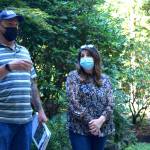 Matt Axe, the Wildfire and Forest Resiliency Coordinator with the King Conservation District, speaks to homeowner Anita Kissee-Wilder about fire reduction strategies at her home in North Bend on Aug. 24. Photo by Conor Wilson/Valley Record.