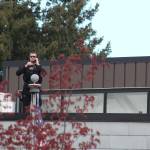 A law enforcement officer scans the crowd outside the Mel Lindbloom Student Union building. Photo by Alex Bruell/Sound Publishing