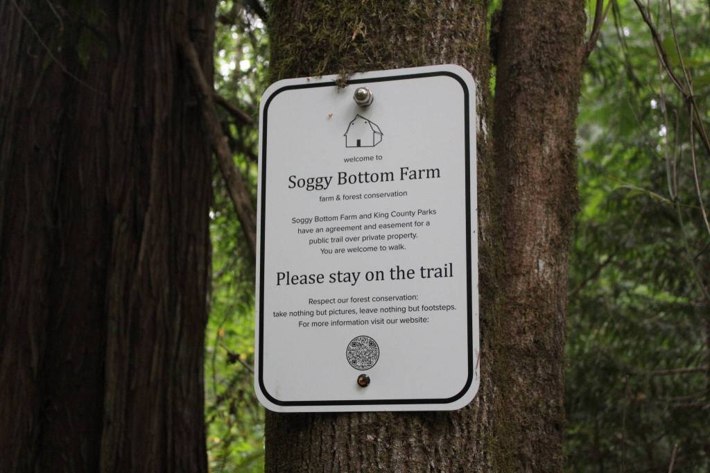 A sign along the trail on Soggy Bottom Farm explaining the agreement and easement between the farm and King County Parks, with a QR code to the farms website. Photo by Bailey Jo Josie/Sound Publishing.