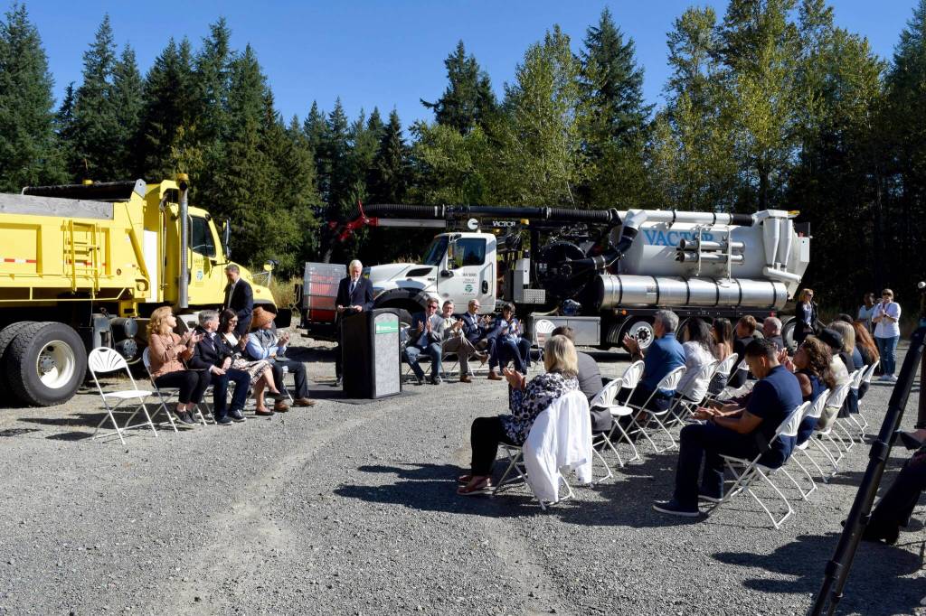 A crowd of officials watches a ceremony on I-90/State Route 18 interchange project. Photo by Conor Wilson/Valley Record