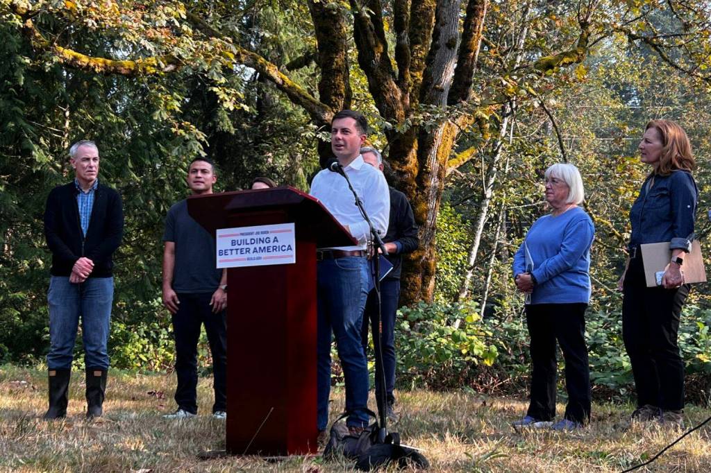 U.S. Transportation Secretary Pete Buttigieg makes statements regarding federal grant money available for fish culvert restoration. (Photo by Cameron Sheppard/Sound Publishing)