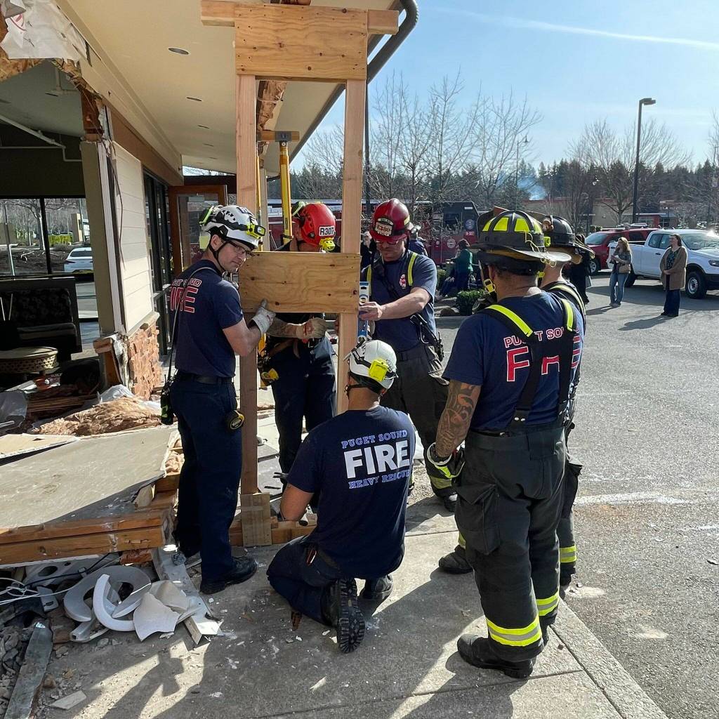 Puget Sound Fires Heavy Team added additional emergency shoring to the unstable roofing once the dumptruck was removed. Photo courtesy of Puget Sound Regional Fire Authority.