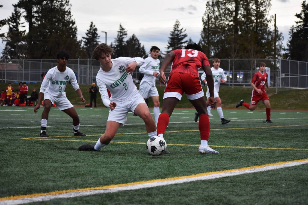 Kentwood High captain Trevor Robertson makes a tackle in his own box against Thomas Jefferson. BEN RAY, Kent Reporter