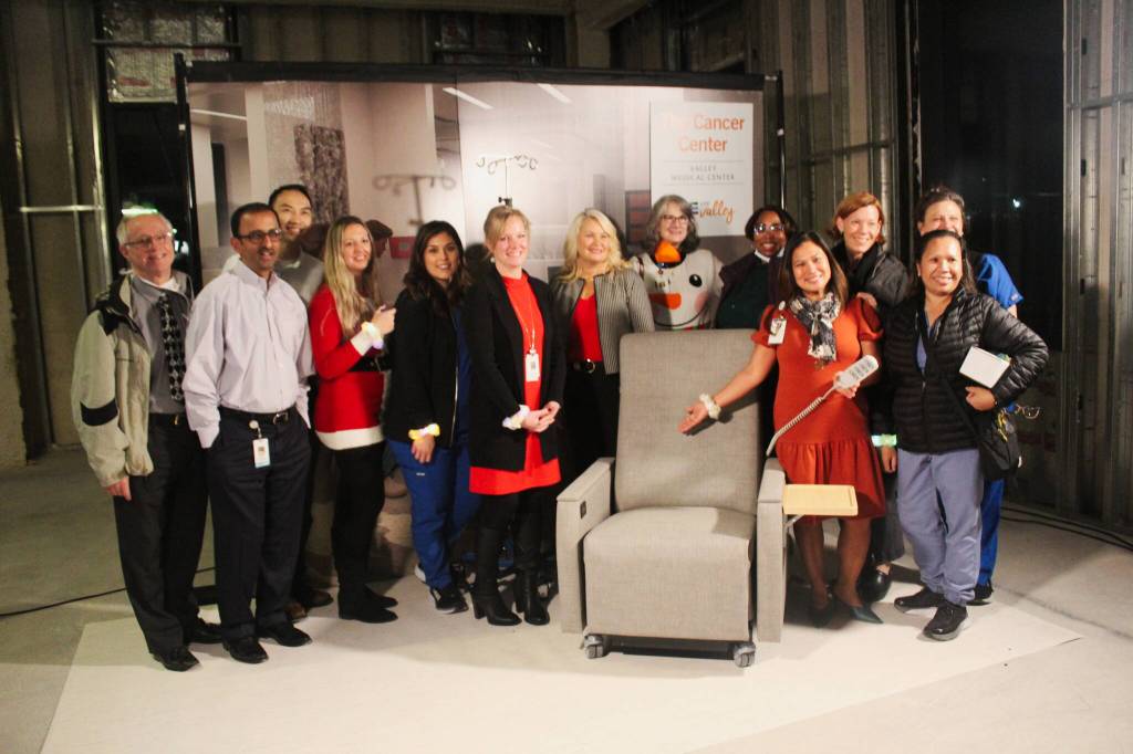 Members of the Valley Medical Oncology department pose with one of the chairs from the Infusion Center. Each chair costs $6,000. Photos by Bailey Jo Josie/Sound Publishing