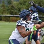Byron Murphy II gets going during a defensive line drill. Photos by Ben Ray / Sound Publishing