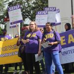 Jordan Middleton and Birpal Bhangu speak to the crowd at the informational picket. Photo by Bailey Jo Josie/Sound Publishing.