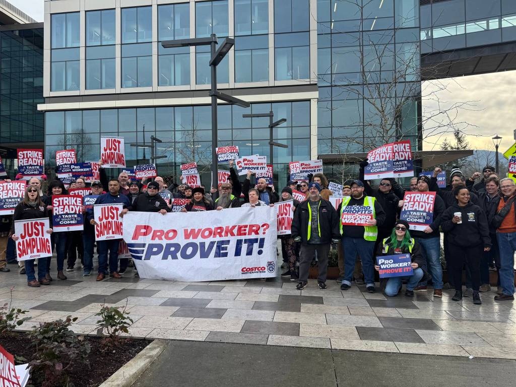 Members of the Costco Teamsters union stand for a group photo with their picket signs, Jan. 23, 2025. (Grace Gorenflo/Valley Record)