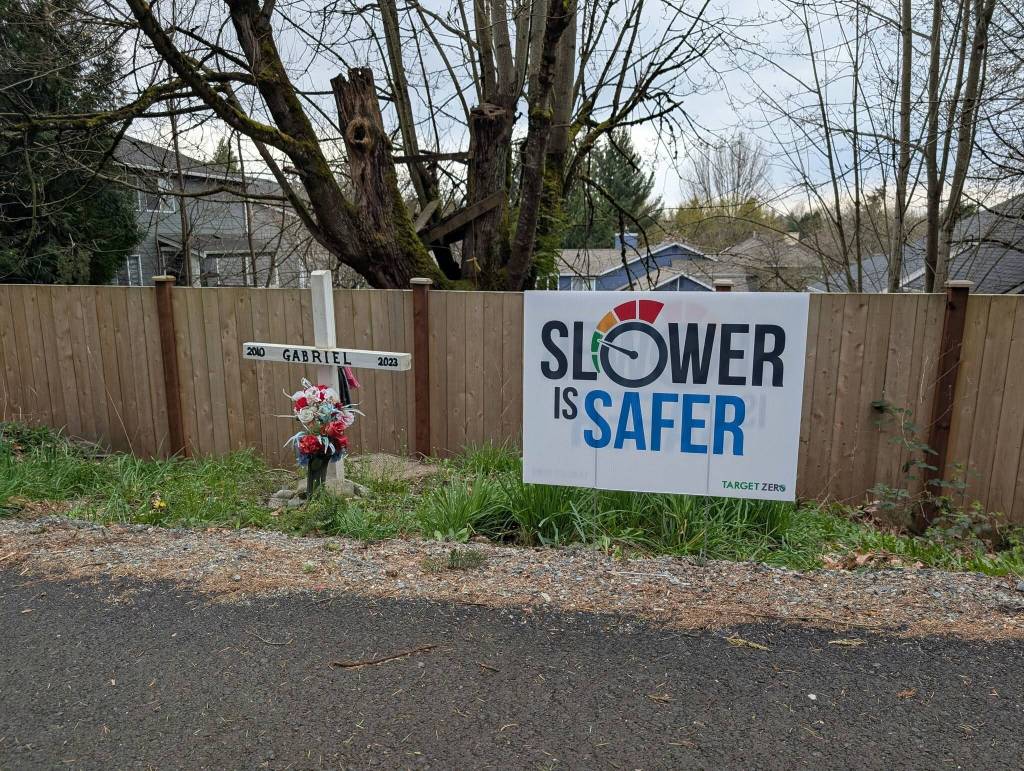 The Coury family placed their Slower is safer yard sign near the roadside memorial dedicated to their son, Gabriel, who was hit by a speeding drunk driver in 2023. Photo courtesy of Shellie Coury