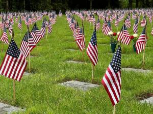 Small American flags adorn headstones at Tahoma National Cemetery in Kent. Photo Courtesy of Tahoma National Cemetery.