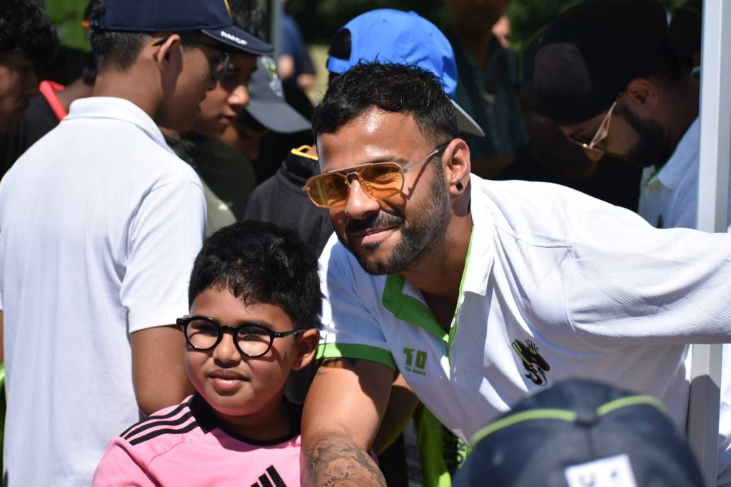 Sanjit Nayak poses with a young fan at Seattle Orcas Fan Fest. Ben Ray / The Reporter