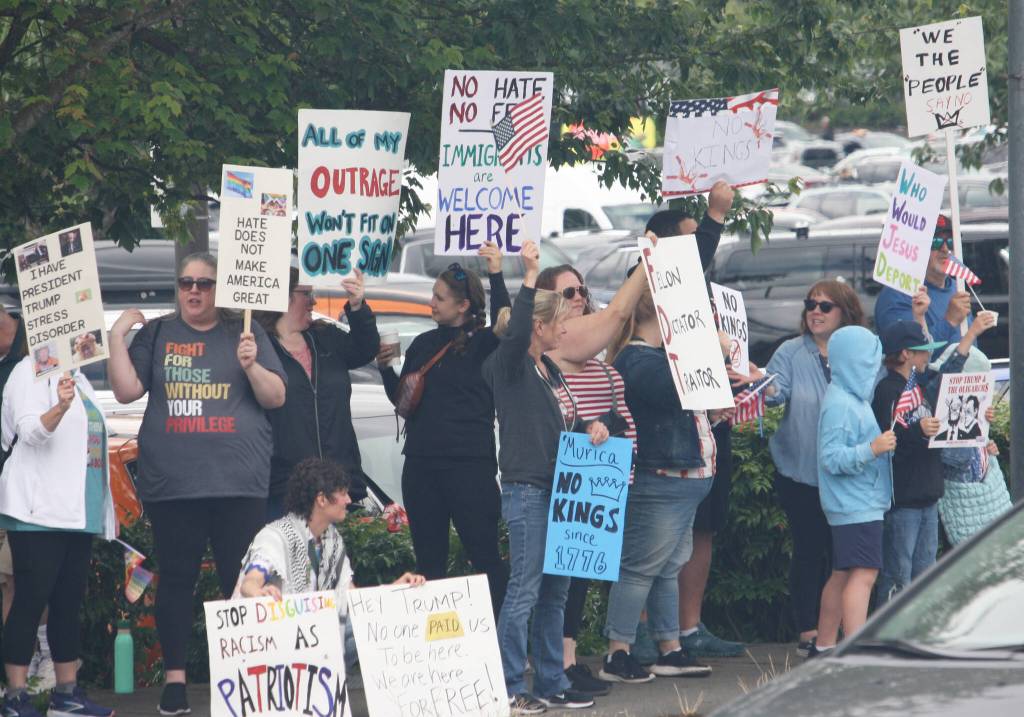 People line both sides of SE 272nd Street (Kent Kangley Road) during a June 14 protest against the Trump administration. STEVE HUNTER, Kent Reporter