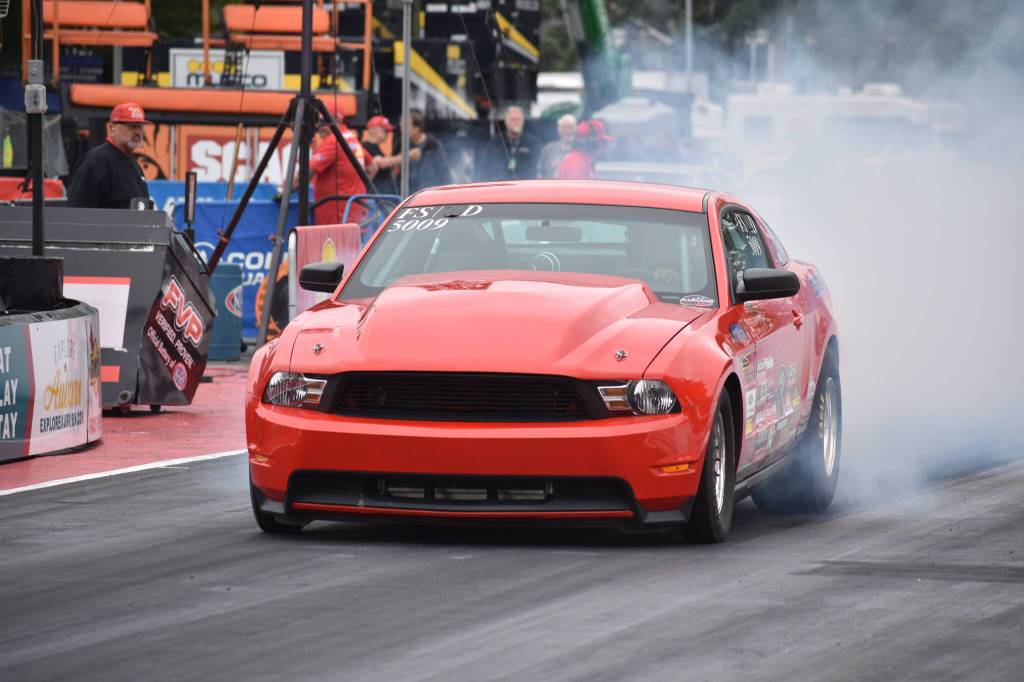 Chevy Camaro does a burn out at Pacific Raceways. Ben Ray / The Reporter