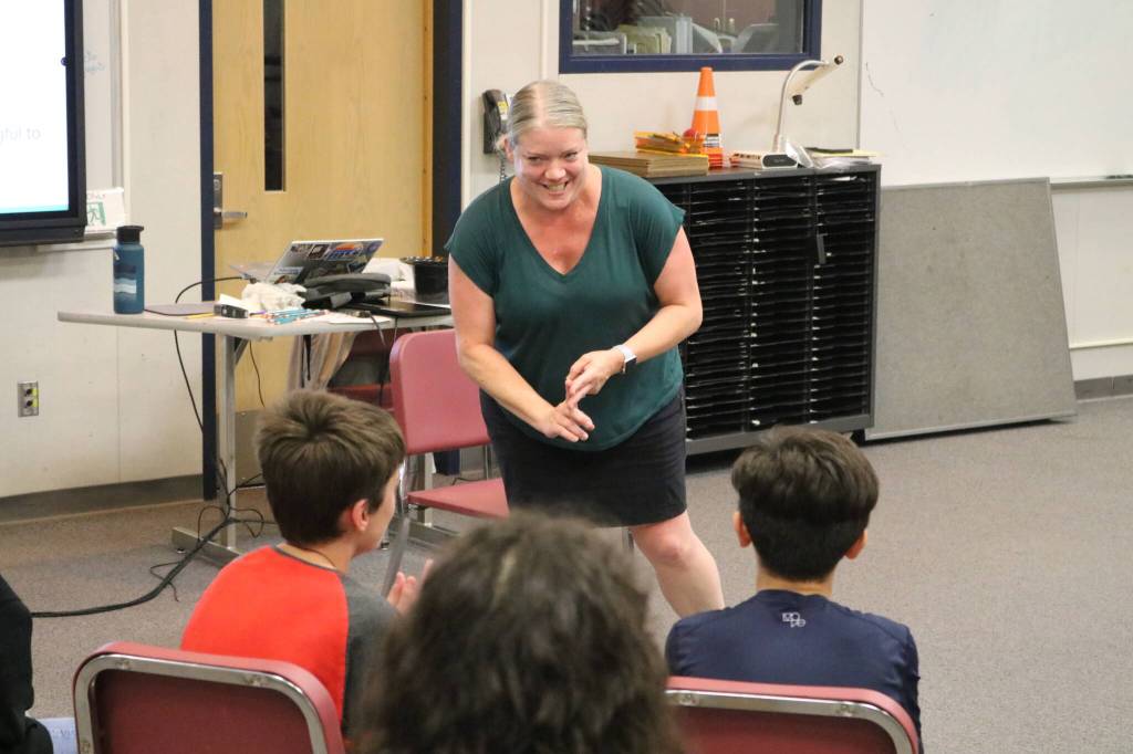Colla Voce director Jackie Grant gleefully teaches her ensemble a mortifying warm-up. Photo by Bailey Jo Josie/Sound Publishing.