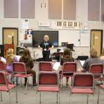 Leora Schwitters leads the Bella Voce ensemble. Photo by Bailey Jo Josie/Sound Publishing.