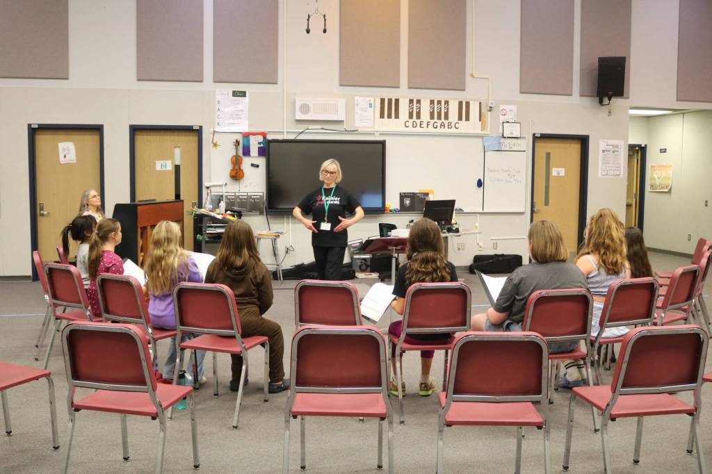 Leora Schwitters leads the Bella Voce ensemble. Photo by Bailey Jo Josie/Sound Publishing.