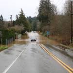 Jones Road near Cedar River has water of the roadway and filling peoples homes from the record-breaking flood. Photo by Bailey Jo Josie/Sound Publishing.