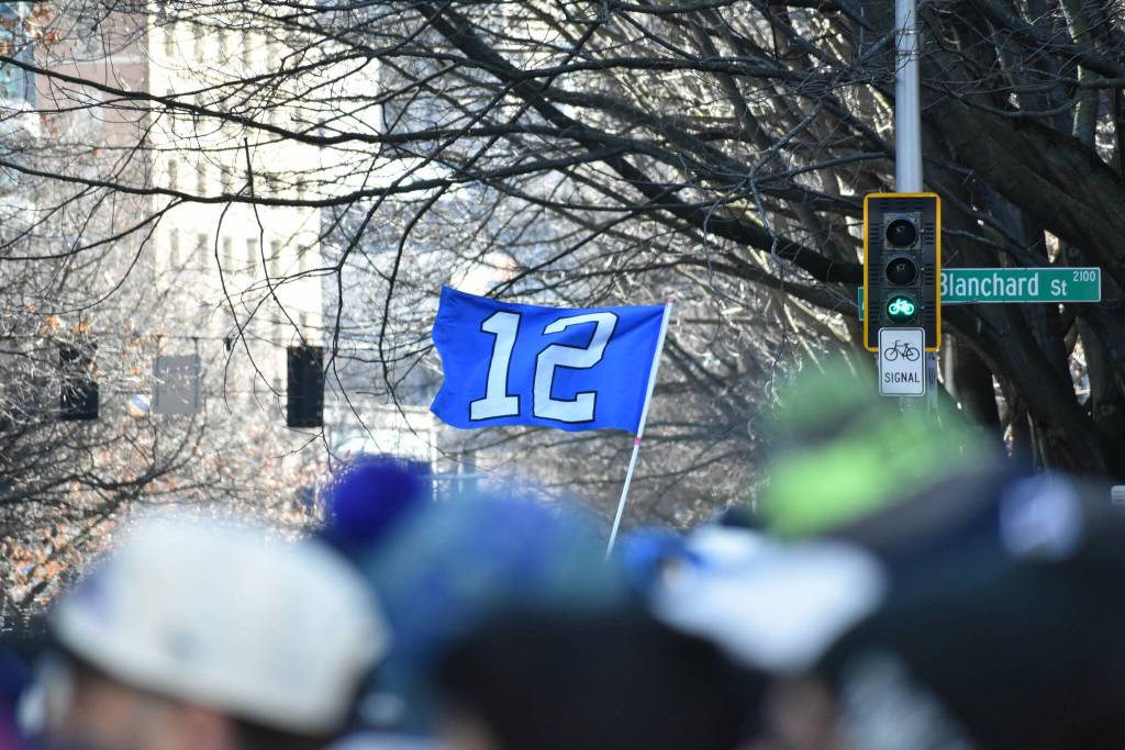 A 12th man flag waves in the wind. Photos by Ben Ray / Sound Publishing