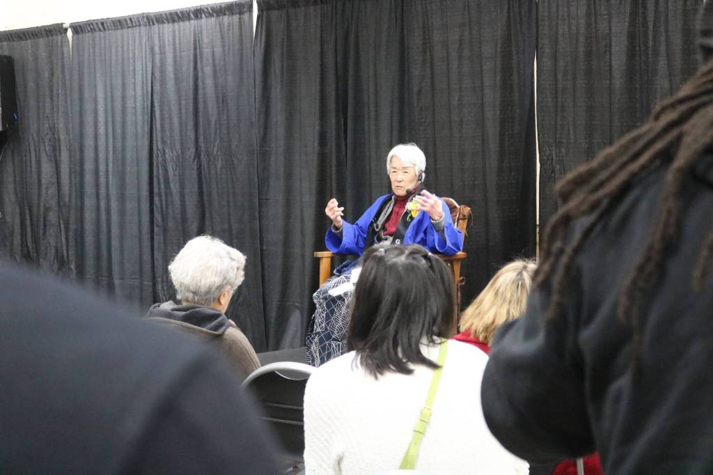 Audience members listen to survivor Hana Konishi tell the story of being incarcerated as a child with her family. Photo by Bailey Jo Josie/Sound Publishing