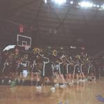 Auburn High School cheerleaders welcome their starting players to the floor. Ben Ray / Sound Publishing