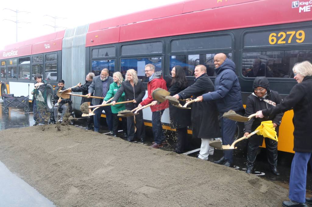 Groundbreaking of the RapidRide I Line in Renton with community members Arya Nguyen and Prem Subedi, Metro General Manager Michelle Allison, State Rep. David Hackney, Auburn Deputy Mayor Tracy Taylor-Turner, Kent Mayor Dana Ralph, Renton Mayor Armondo Pavone, King County Councilmembers Steffanie Fain and Pete von Reichbauer, King County Executive Girmay Zahilay, State Rep. Debra Entenman and Renton Councilmember Valerie OHalloran. Photo by Bailey Jo Josie/Sound Publishing