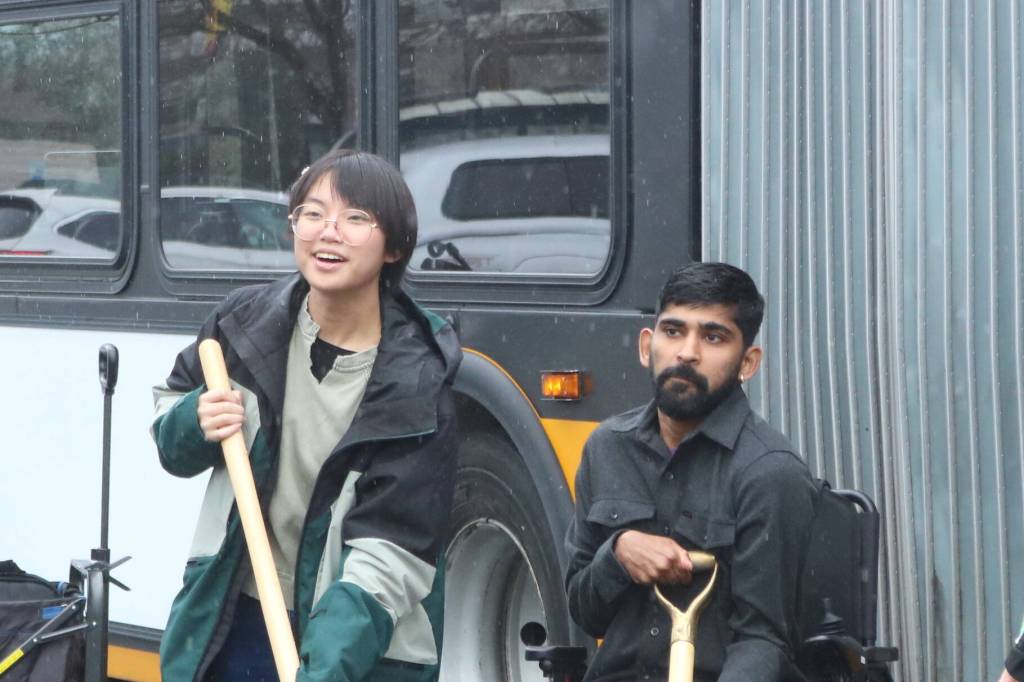 Community members Arya Nguyen and Prem Subedi were part of the groundbreaking event after speaking to the crowd about their experiences using King County Metro. Photo by Bailey Jo Josie/Sound Publishing