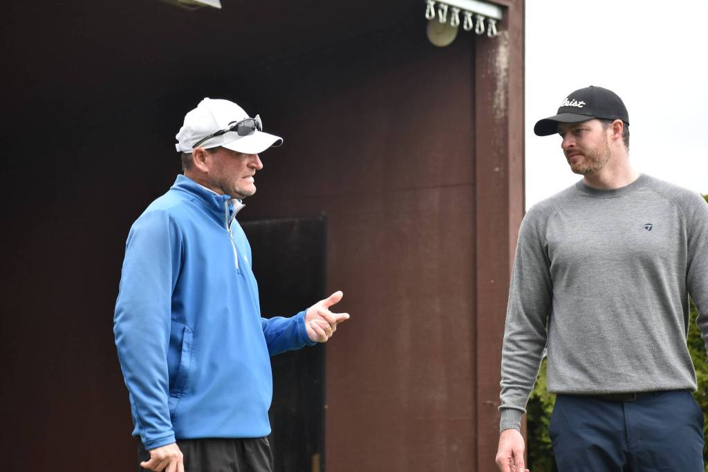 Brian Thornton talks with intructee during a lesson. Ben Ray / The Reporter