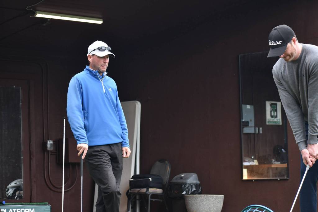 Brian Thornton watches as he gives lessons at Meridian Valley Country Club. Ben Ray / The Reporter