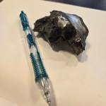 A piece of shrapnel from the front lines (pencil for scale). Photo by Keelin Everly-Lang / the Mirror.