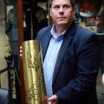 Mayor Jim Ferrell holds an artillery shell with the emblem of Ukraine engraved in it - a gift from Federal Ways sister city of Rivne, Ukraine.